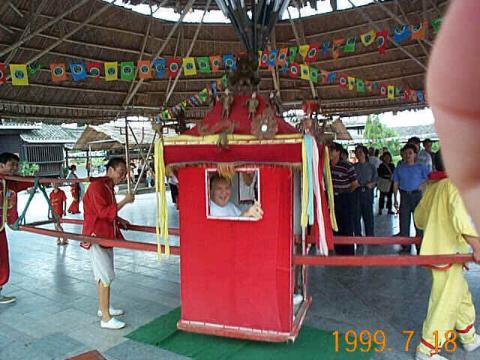 Craig in sedan chair